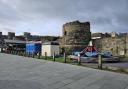 ‘Tacky’ attractions and drinks vendor cabins set up in the shadow of Conwy’s 13th century castle have been criticised as unfitting for the medieval town..