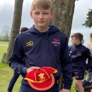 Casey Bedford with his Wales cap after being selected to represent his country at under-13s level.