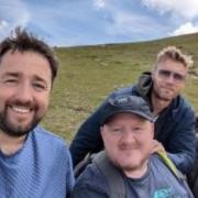 Pals Freddie Flintoff and Jason Manford pose for selfies with hikers on Snowdon. Photo: Bill Faichney