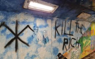 Vandals have been reported to police after scrawling graffiti on a Conwy underpass inciting violence..