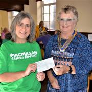 Rotary Club President Pauline Hogan presents the check to Macmillan Cancer Support.