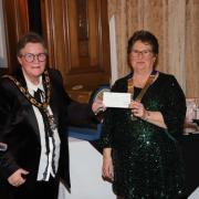 Mayor of Llandudno, Cllr Carol Marubbi receiving a cheque for the Mayor's annual charity.