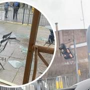 Damaged traffic light and inset -  a glass panel crashed down outside Love to Eat