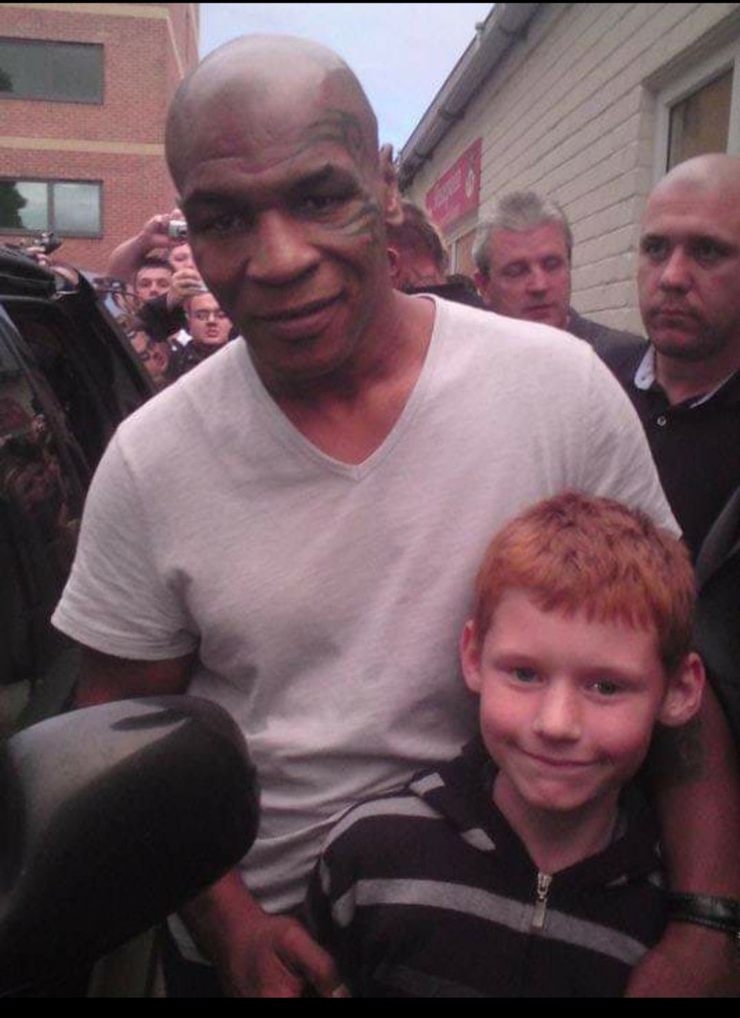 Rebecca Griffiths, from Gwersyllt, has this photo of a special meeting for son Liam Roberts, 13 years ago: Mike Tyson saw my son as he was leaving the event at the Centenary Club at Wrexham FC and come over to meet him.