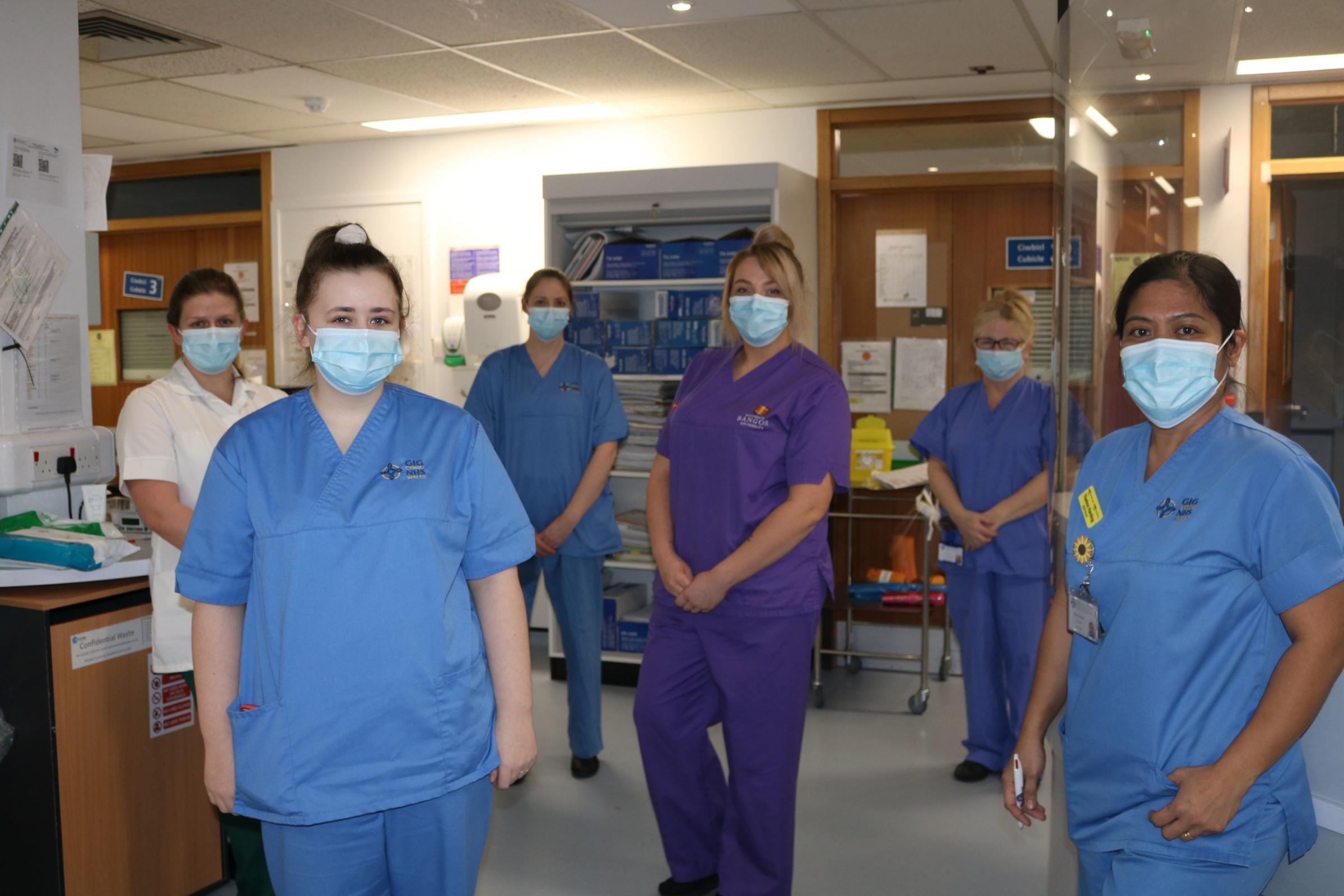 Abby (centre) with her colleagues on Aran Ward who have been caring for Covid patients throughout the pandemic.