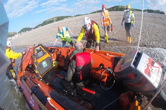 The kayakers were escorted to safety on Craig y Don beach.