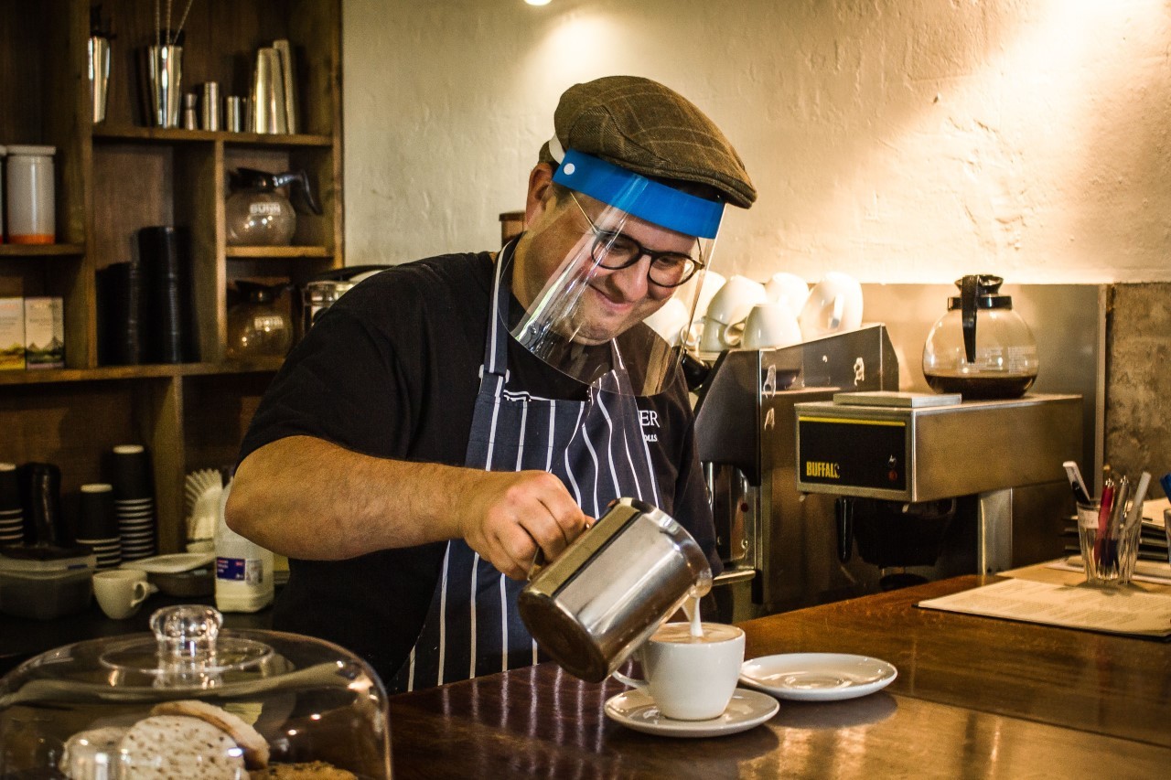 Russel Erwood, known as Conwy Jester Erwyd Le Fol, makes a coffee