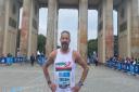 Jon Evans by the famous Brandenburg Gate in Berlin