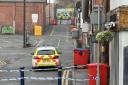 Police officers in Colwyn Bay and police tape on Monday, November 20