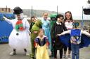Pupils (pictured from the snowman) Hari, Albie, Rhiannon, Daynie, Henry, Lyla, Walter and Jasmine. The children dressed up in fancy dress last week in exchange for an item for the Christmas hampers.