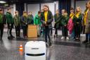 A pupil from Ysgol Dafydd Llwyd test out the Omron mobile robot from Reeco at Newtown College.