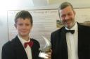 Daniel Blair receives his award from Gerry Frobisher