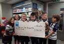 Colwyn Bay Rugby Club minis and the cheque they received from the Co-op