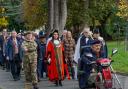 Veterans and Conwy mayor Cllr Ryan lead the parade from Bodlondeb to St Mary's and All Saints Church. Picture: Conwy Camera Club
