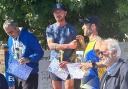 Jonathan Kettle on top of the podium after his half narathon victory in Cyprus.