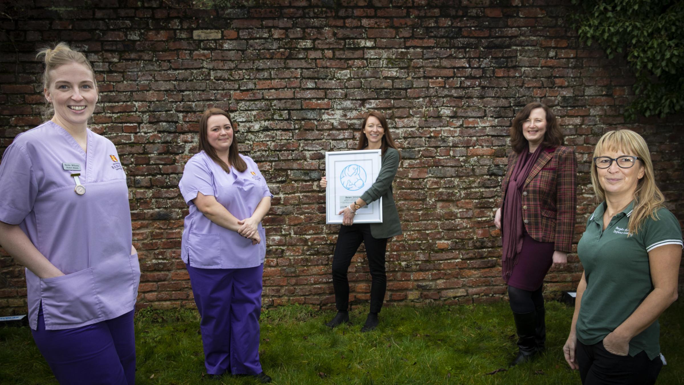 Pictured Becks Williams, student midwife; Becky Gates, student midwife; Lauren Irving, Midwifery Lecturer; Sheila Brown, Lead Midwife for Education and Michelle Darlington, Infant Feeding Support Worker at Betsi Cadwaladr University Health Board. 