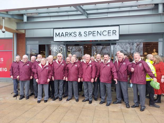 North Wales Pioneer: The Maelgwyn Male Voice Choir outside Llandudno's new M&S store