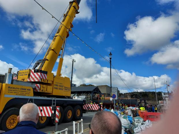 North Wales Pioneer: The crane prepares to lift the boat from its platform