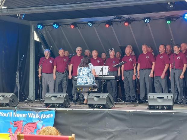 North Wales Pioneer: The Maelgwyn Male Voice Choir, who sang renditions of 'O Gymru' and 'You'll Never Walk Alone' among others, and even taught the crowd some Welsh, in front of a Ukrainian flag with a Welsh dragon