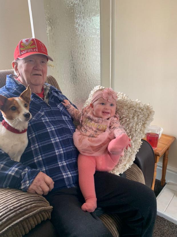 North Wales Pioneer: Phil with his dog, Myfi, and great-granddaughter, Olivia. Photo: Kevin Talbot