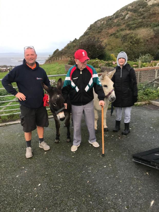 North Wales Pioneer: Phil with son Kevin and daughter Sonya saying farewell to his last two donkeys, Snowy and Heidi. Photo: Kevin Talbot