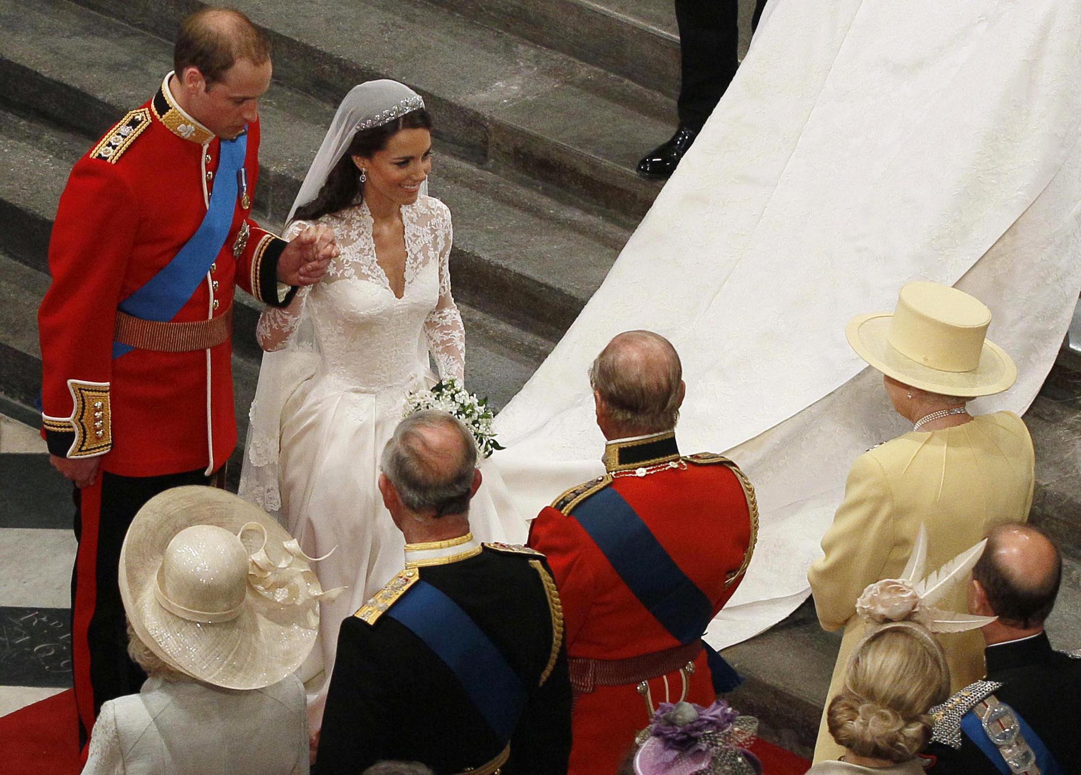 File photo dated 29/04/11 of Prince William and his new bride Kate bow before Queen Elizabeth II following their marriage at Westminster Abbey, London.