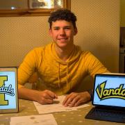 Charley signing with University of Idaho's Vandals team.