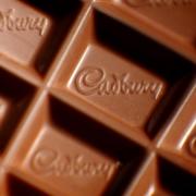 Mondelez has urged stores to remove certain boxes of Cadbury Milk Tray because of taste concerns