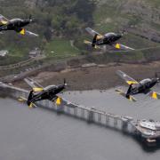Four Texan TMk 1 aircraft of 72(F) Squadron at RAF Valley fly over Llandudno in a salute to His Majesty The King.