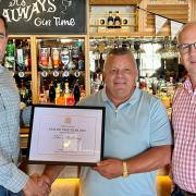 Robin Millar MP presents the award to pub licensee Jason Taylor and William Robinson, the Chief Executive of Robinson’s Brewery.