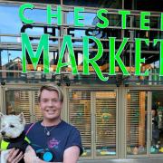 Kris Meredith in front of Chester Market with Westie Burt.