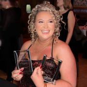 Cassie McClymont with the two national wedding awards.