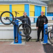 Cllr Goronwy Edwards and Julie Birchall, Conwy’s Road Safety Officer at Penmaenmawr bike station.