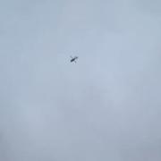 Helicopter circling over Kinmel Bay