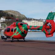 Air ambulance helicopter on Llandudno promenade today.