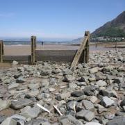 Llanfairfechan beach with razor clam shells in the foreground.