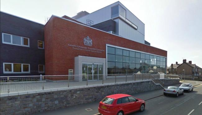 A snap of a woman’s breasts had been posted on Facebook by two other women after an exchange of text messages, Caernarfon Crown Court heard